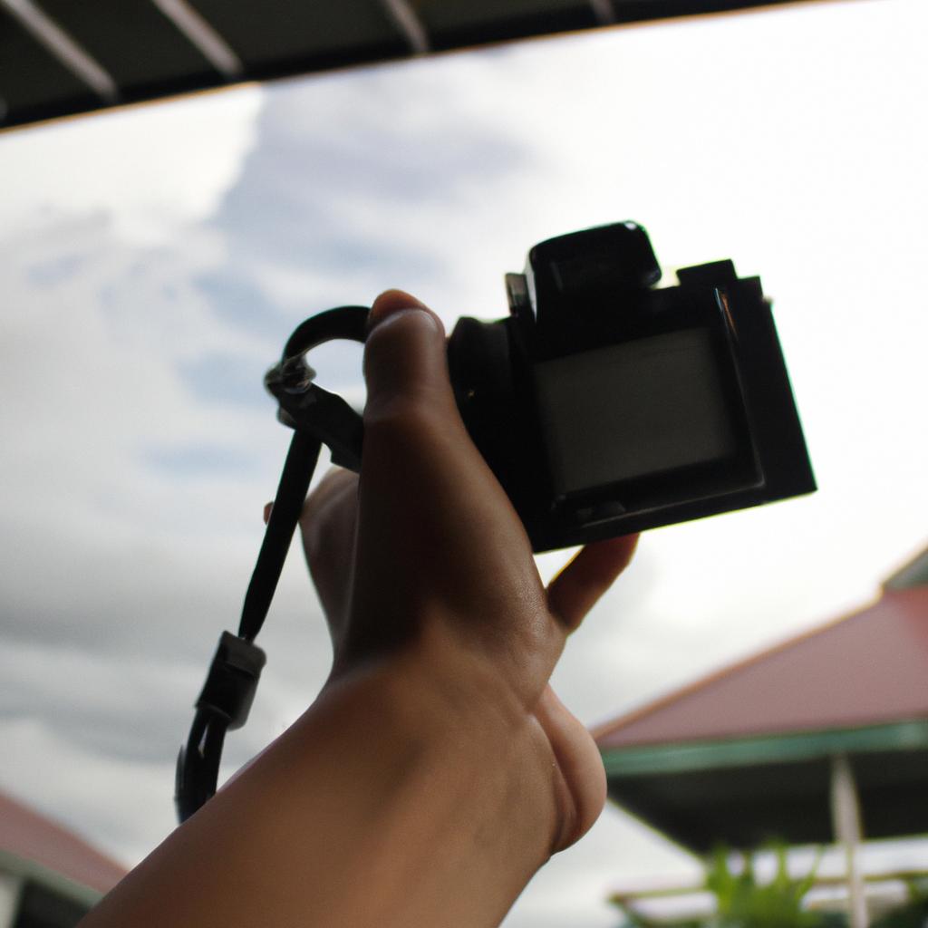 Person holding camera, framing shot